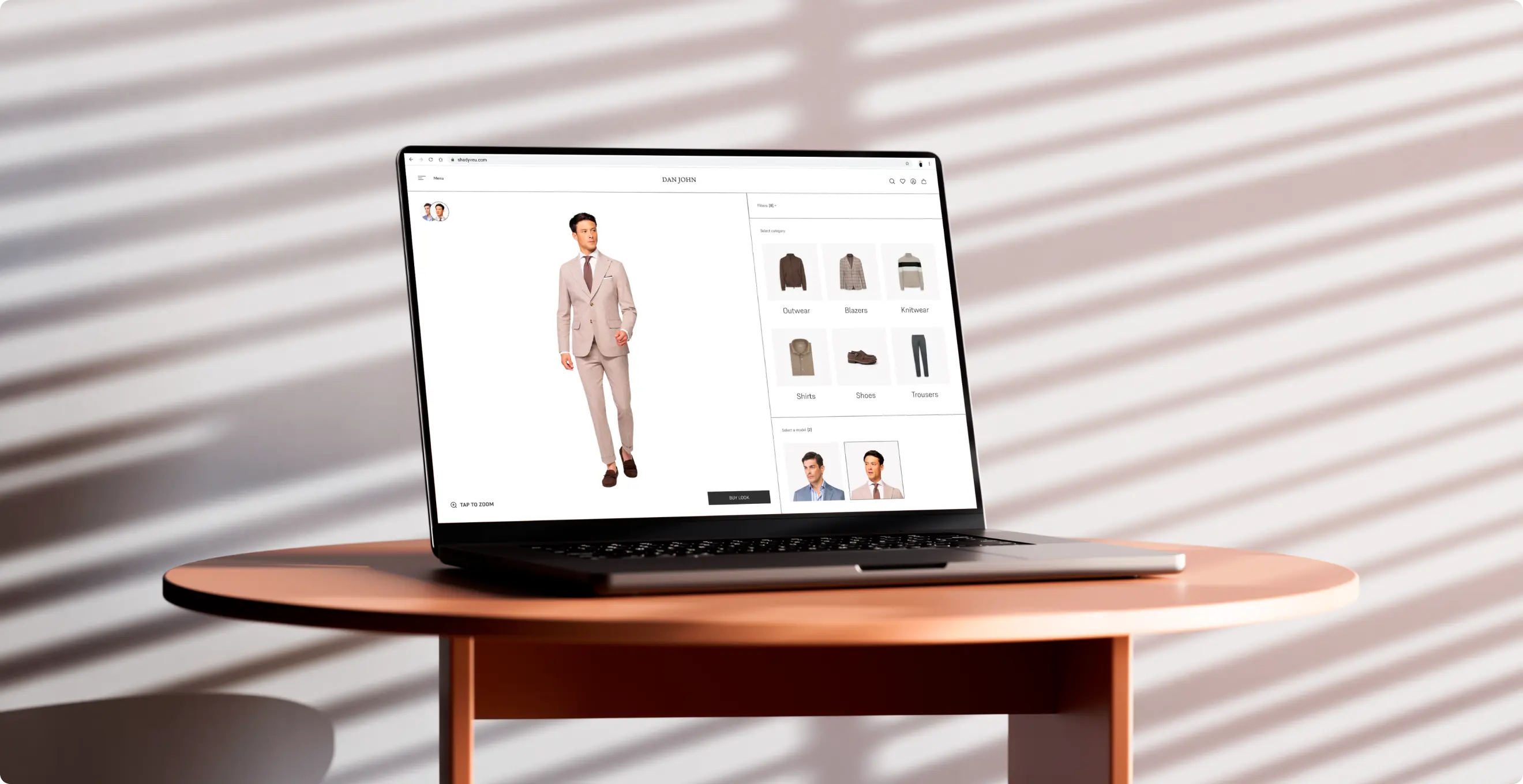 Dan John online fitting room displayed on a laptop